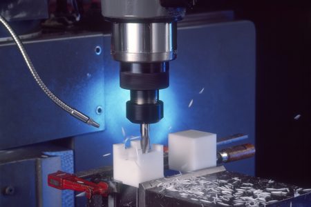 Closeup of Plastic Manufacturing Action with Blue Glow